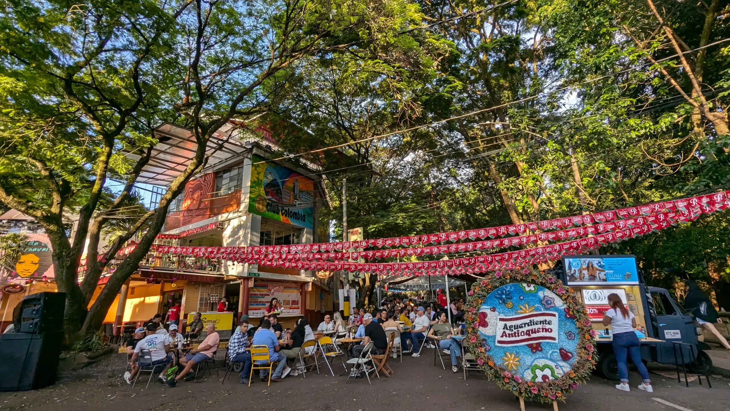 Outdoor café life under the trees in El Poblado, Medellín