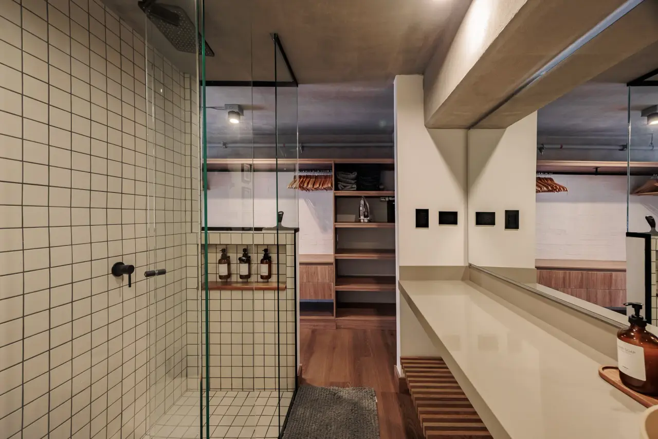 Tiled shower behind a glass screen at Centro Loft