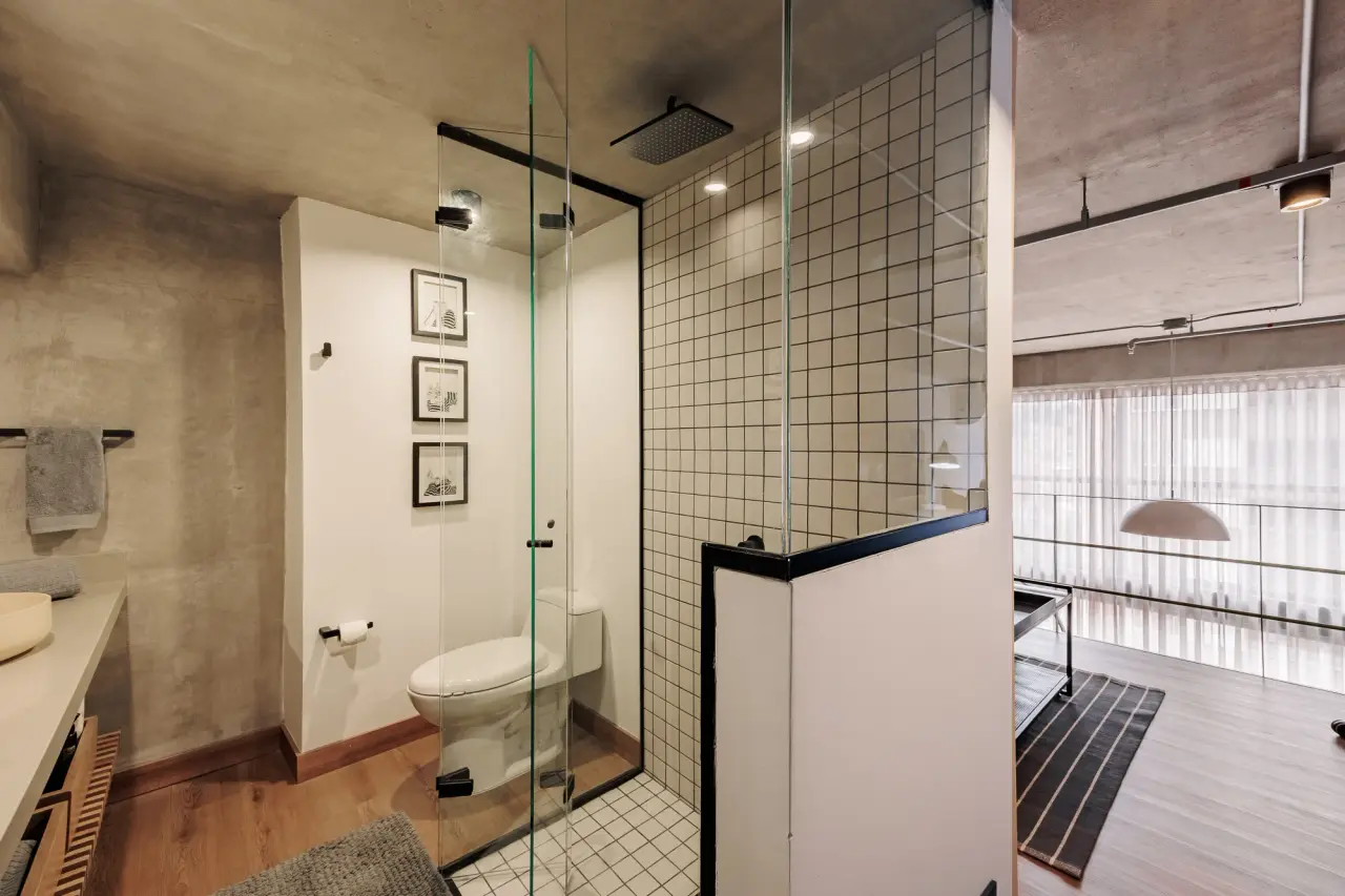 Shower and toilet, with the loft beyond the glass