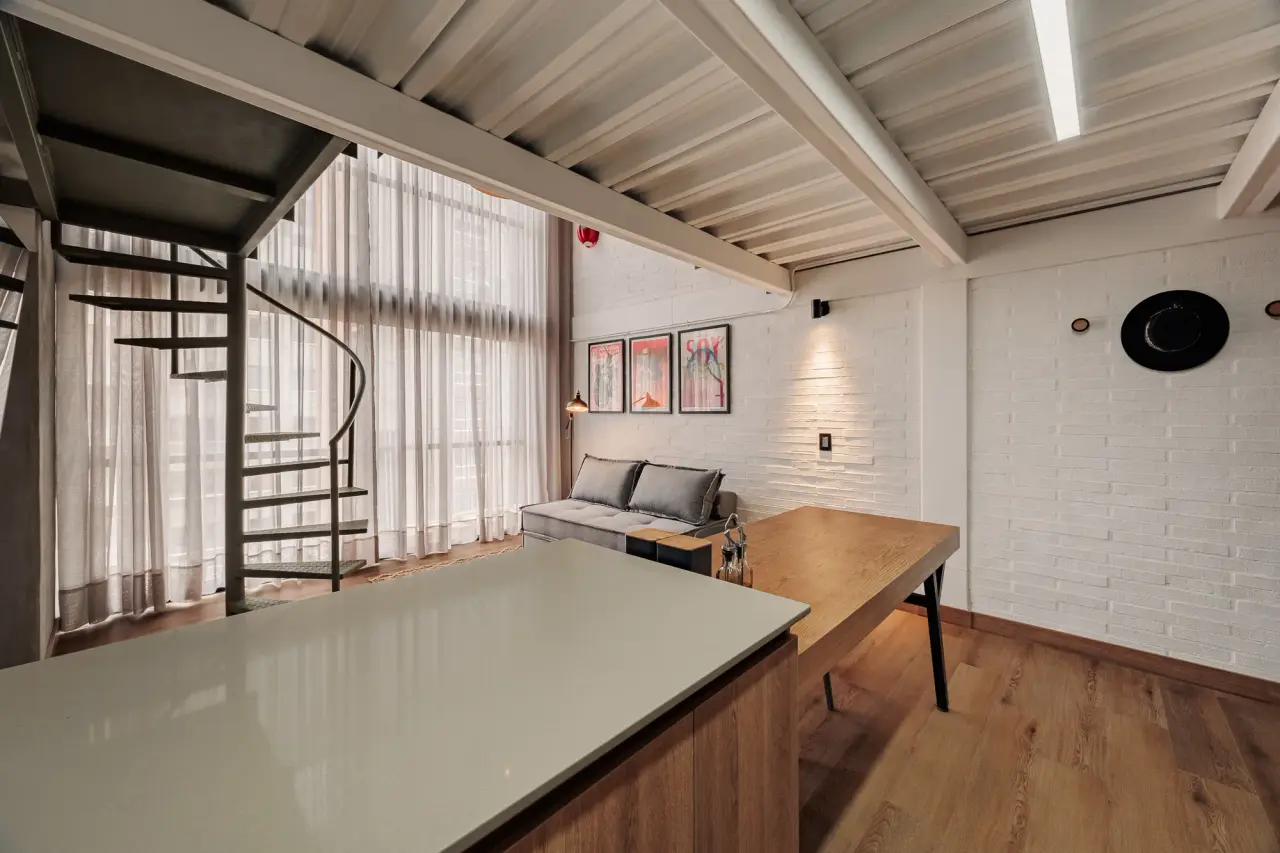 Kitchen island and dining table, with the spiral stair alongside